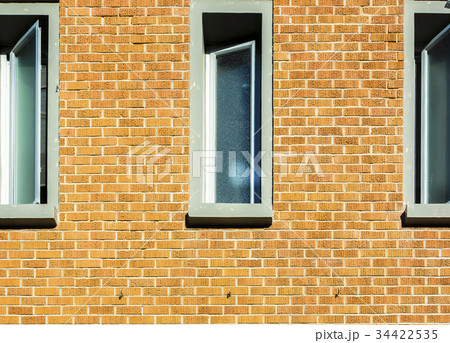 Windows on brick wall in a sunny day 34422535