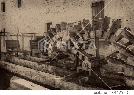 Old wheels of a watermill. Vintage style picture.  34425239