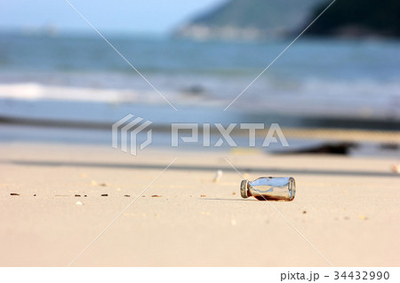 Medicine bottle trash on the beach. 34432990