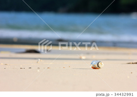 Medicine bottle trash on the beach. 34432991