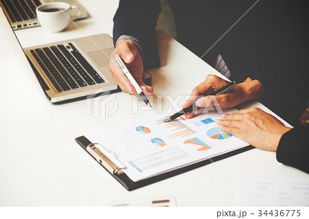 Business team meeting present. 34436775