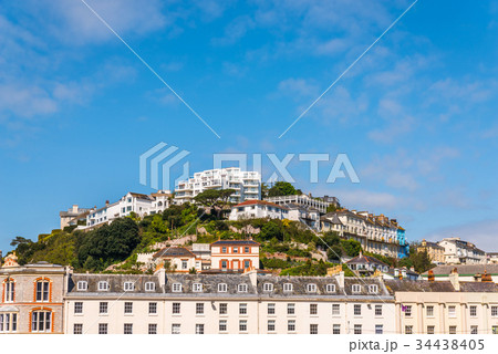 houses on a cliff hill, on rock among green plants houses on a cliff hill, on rock among green plants 34438405