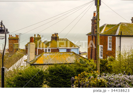 Roofs of buildings covered with green moss Roofs of buildings covered with green moss 34438623
