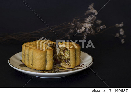 Moon cakes filled with mixed nuts black background 34440687