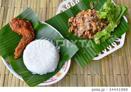 fried chicken wing and spicy minced pork salad fried chicken wing and spicy minced pork salad 34441989
