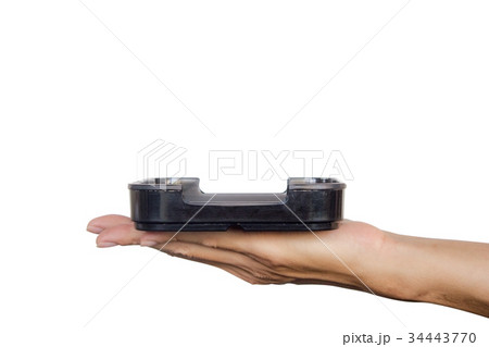 Hand holding black plate isolated on white  34443770