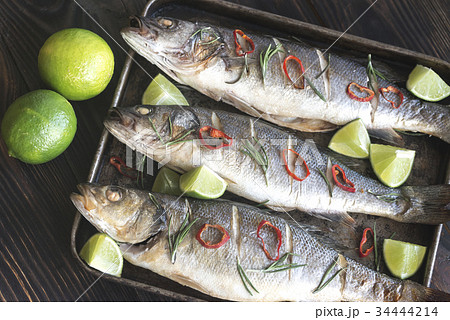 Baked sea bass with lime and chilli pepper Baked sea bass with lime and chilli pepper 34444214