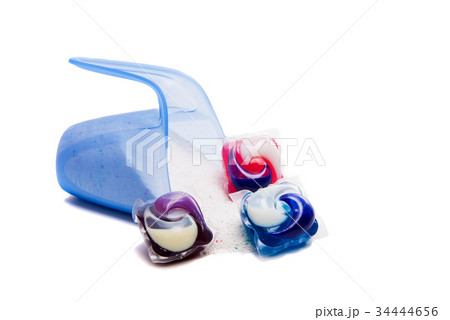 Washing powder in a measuring cup isolated Washing powder in a measuring cup isolated 34444656