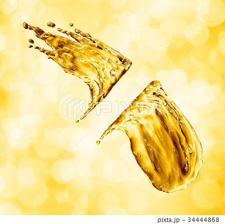 oil splash on gold bokeh background oil splash on gold bokeh background 34444868