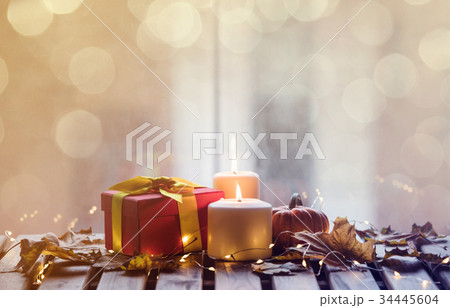 pumpkin, gifts and candles with maple leaves pumpkin, gifts and candles with maple leaves 34445604