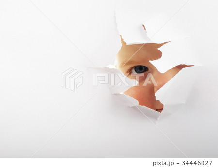 Little baby looking out of a hole Little baby looking out of a hole 34446027