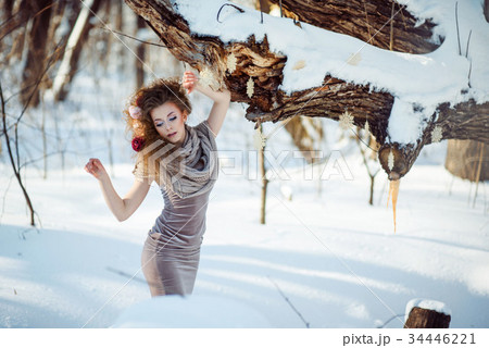 beautiful girl in the winter forest  34446221