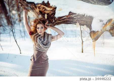beautiful girl in the winter forest  34446222