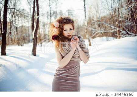 beautiful girl in the winter forest  34446366