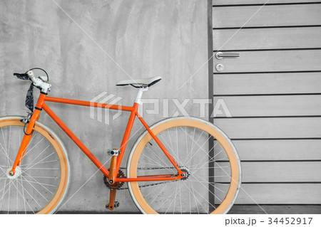 orange bicycle parked decorate interior 34452917