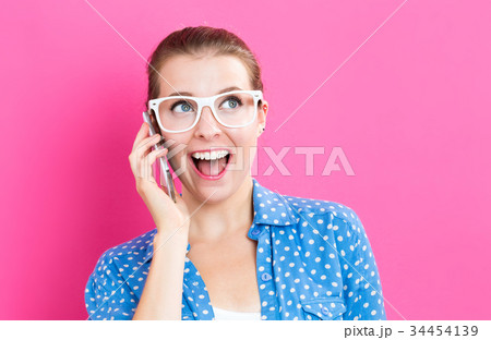 Young woman talking on the phone 34454139