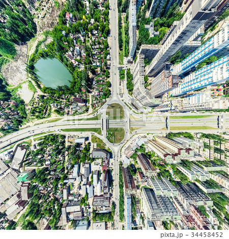 Aerial city view with crossroads and roads, houses Aerial city view with crossroads and roads, houses 34458452