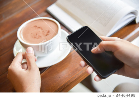 Woman Hands using smart phone 34464499