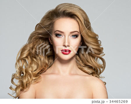 Pretty woman with long hair and red lips. Pretty woman with long hair and red lips. 34465269
