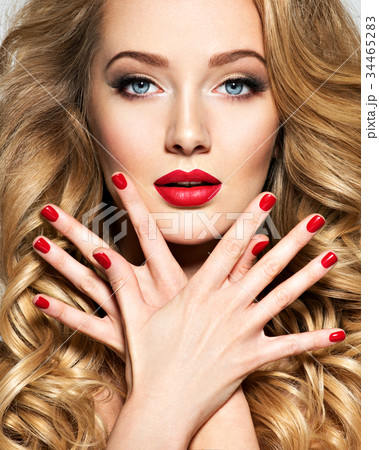 Pretty woman with long  hair and red nails 34465283