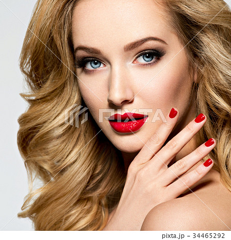 Pretty woman with long  hair and red nails 34465292