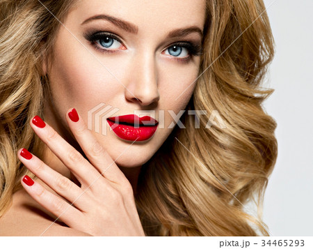 Pretty woman with long  hair and red nails 34465293