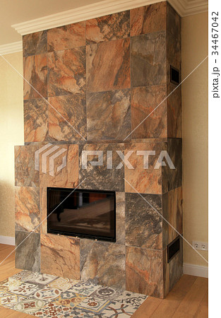 Contemporary stone fireplace in living room 34467042