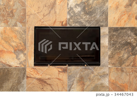 Luxurious stone tile fireplace detail Luxurious stone tile fireplace detail 34467043