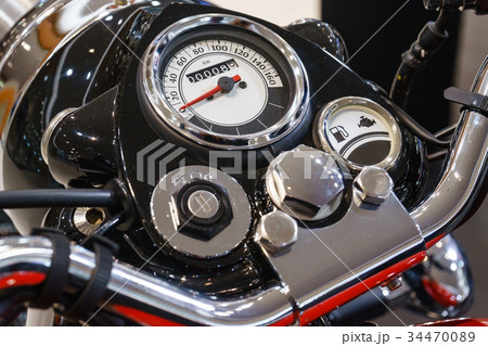 Chromed speedometer of retro motorcycle closeup Chromed speedometer of retro motorcycle closeup 34470089