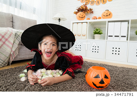 cute happy girl holding her sweet candies 34471791