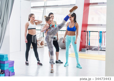 Attractive young girl showing high kick to her 34473443