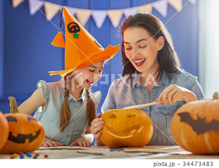 family preparing for Halloween. 34473483