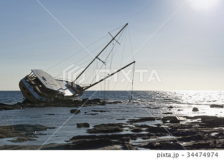 Sailing ship stranded on the rocks 34474974
