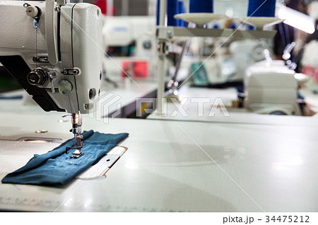 Sewing machine on textile fabric closeup, nobody 34475212
