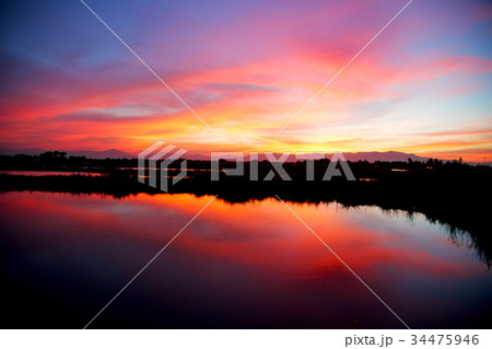 view from water of the sunrise full of  colors 34475946