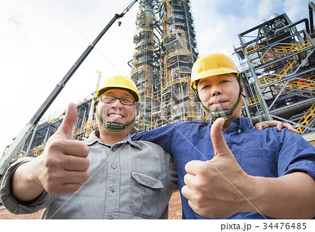 two happy  Factory workers  with thumb up 34476485
