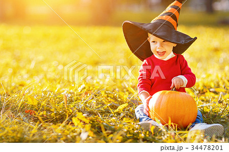 baby boy with pumpkin outdoors in halloween baby boy with pumpkin outdoors in halloween 34478201