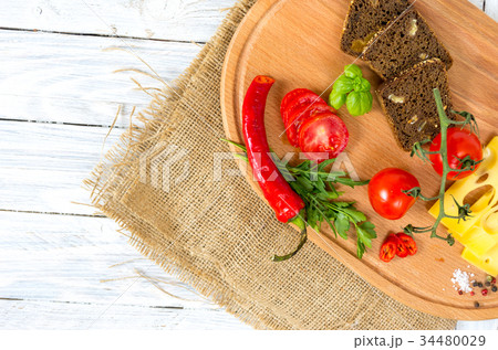 Fresh vegetables on a cutting board. Copyspace. Fresh vegetables on a cutting board. Copyspace. 34480029