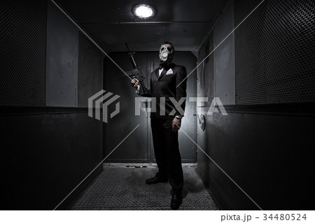 Male with the rifle and gas mask Male with the rifle and gas mask 34480524