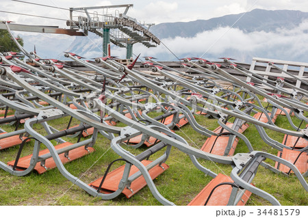 Ski lift chairs waiting to be used in the Alps 34481579