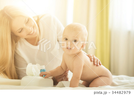 Portrait of happy mother with infant son 34482979