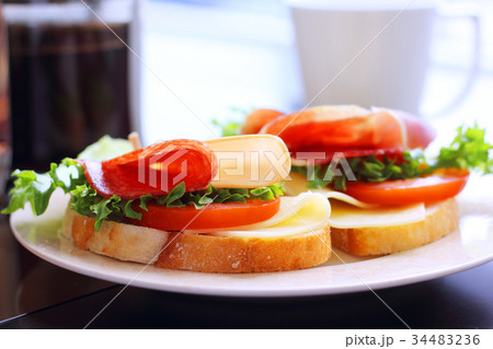 Breakfast with sandwich and coffee Breakfast with sandwich and coffee 34483236
