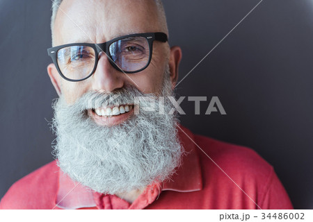 Delightful stylish gray-haired man is expressing Delightful stylish gray-haired man is expressing 34486002