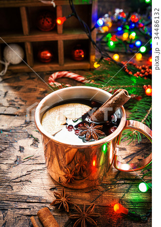 Mulled wine in copper mug. 34486132