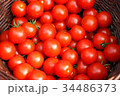 Group of organic tomatoes in a basket. 34486373