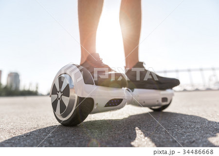 Man legs riding on gyroscope 34486668