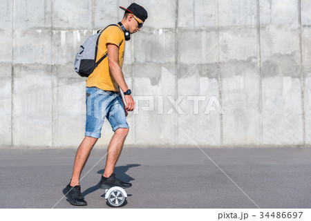 Serene teenager going on gyroscooter 34486697