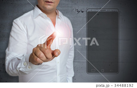 SmartPhone touchscreen is operated by man 34488192