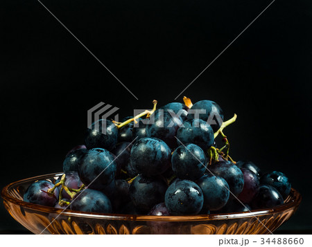 Red grapes on the table 34488660