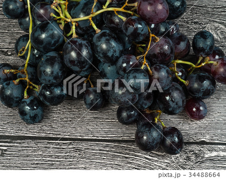 Red grapes on the table 34488664